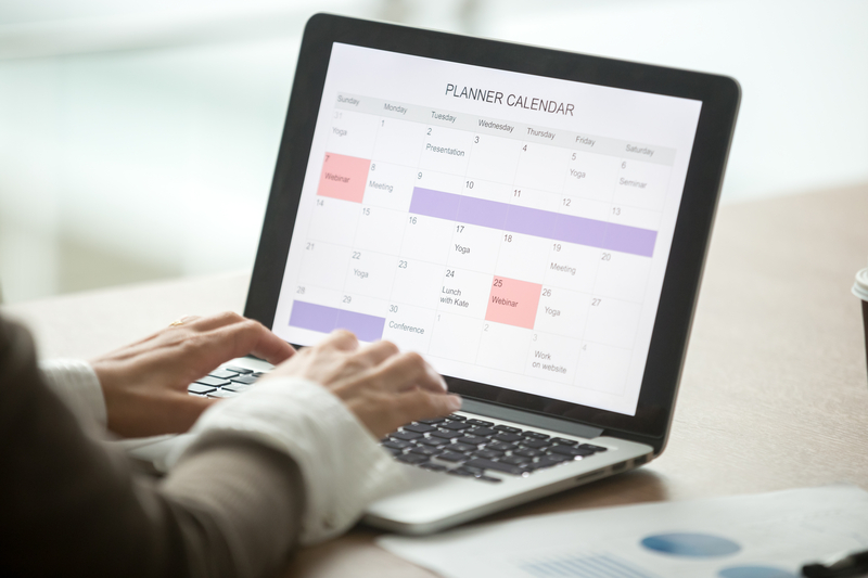 Businesswoman setting up her digital payroll calendar